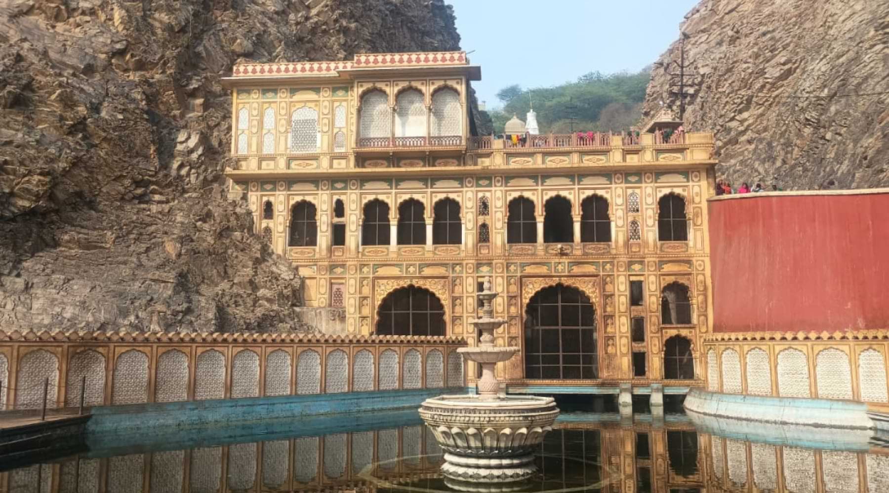 Historic Galtaji cliff temple in Jaipur with sacred water tank Galtaji temple Jaipur water tank