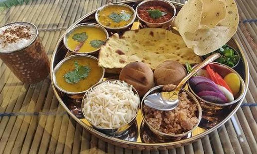 A traditional plate of Dal Baati Churma, iconic Rajasthani food Famous Dal Baati Churma Dish